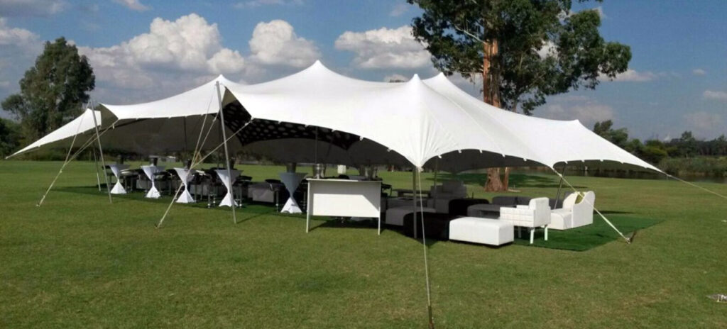 white wedding stretch tents in a sunny weather